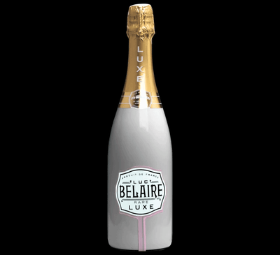 Bottle of Belaire Luxe champagne with a gold foil top on a white background